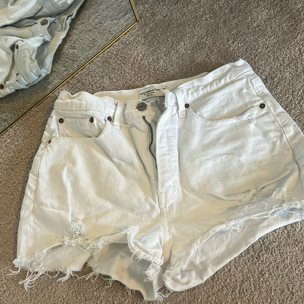 High waisted and flattering white denim cutt offs
